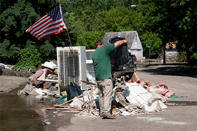 Follow laws and guidelines for disposing of household items afer a flood.